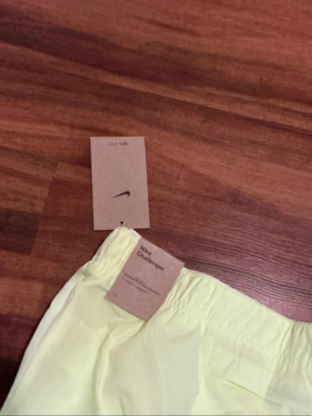 Nike men’s Pale Yellow Running Shorts with Reflective Swoosh nwt logo pockets